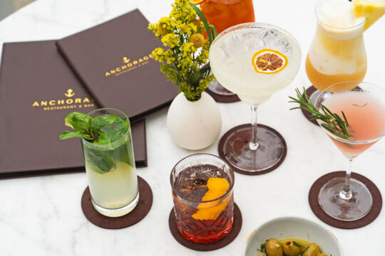 Assortment of handcrafted cocktails and menus at Anchorage Restaurant in Turks and Caicos