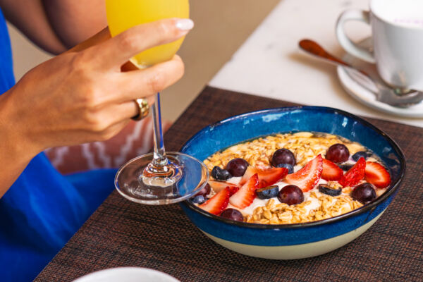 Greek yogurt bowl with granola and strawberries at a restaurant