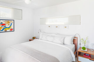 Bed in modern villa bedroom.