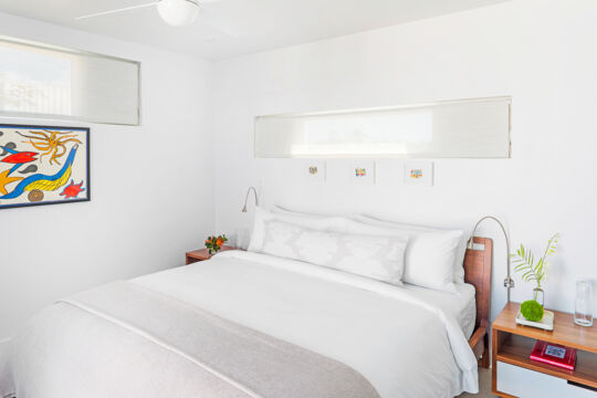 Bed in modern villa bedroom.