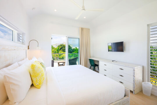 Modern and bright bedroom with a private balcony.