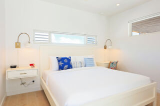 Bed in modern villa bedroom.