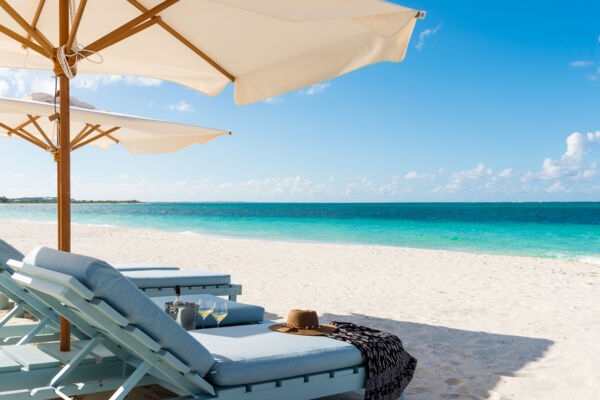 Beach lounger and umbrella on the Bight Beach at the Beach House