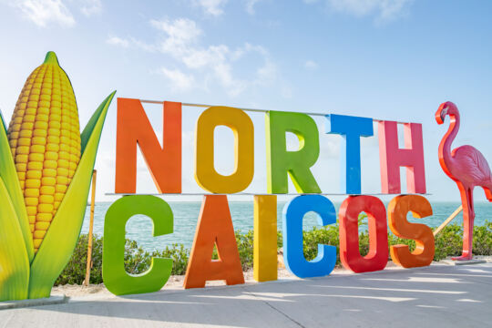 The large North Caicos welcome sign at Bellefield Landing.