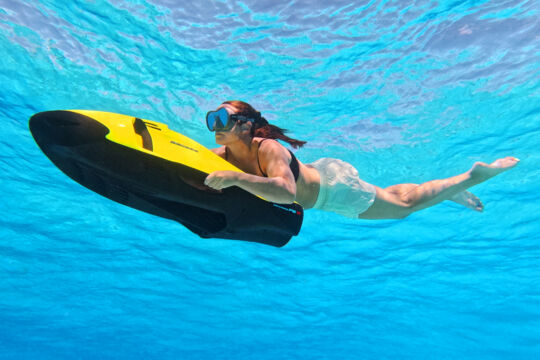 Woman using a seabob in Turks and Caicos. 