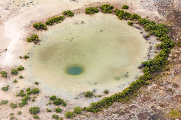 Aerial view of a small blue hole near Big Pond on Middle Caicos.