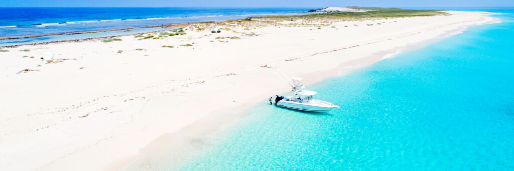 Beach and boat at Big Sand Cay in the Turks and Caicos