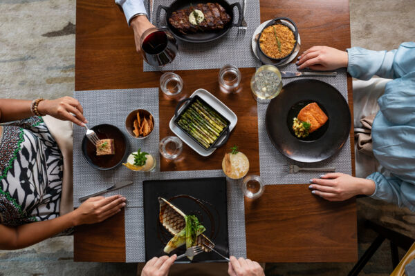 Overhead view of dining table with food at BLT Steak in Turks and Caicos