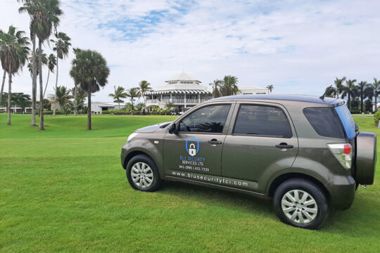 Security car parked at a golf course