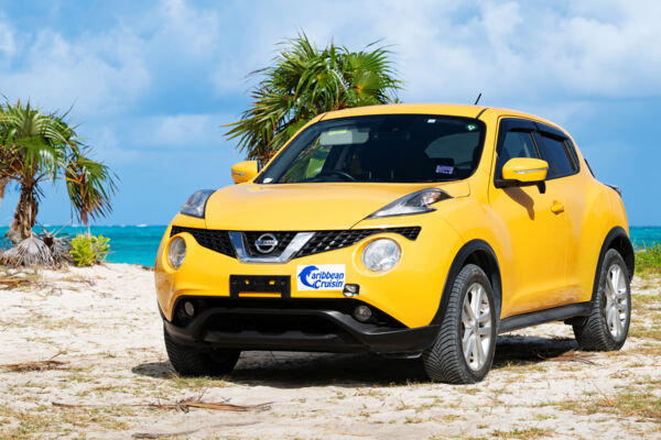 Yellow Nissan Juke parked near a beach on North Caicos. 