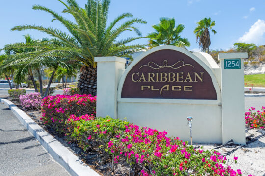 Concrete sign for Caribbean Place