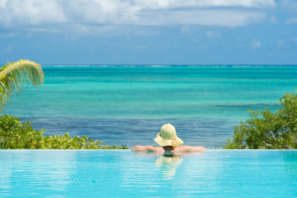 Infinity edge pool with person in it