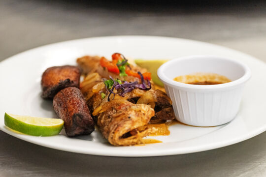 Plate of snapper fish and plantains.