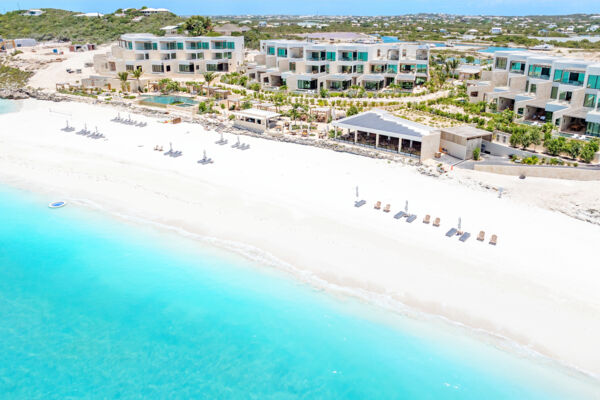 Aerial image of Cooper Jack Bay Beach and The Strand resort. 