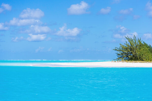 White sand beach and turquoise ocean at Dellis Cay in the Turks and Caicos