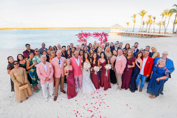 Group photo of wedding guests at a beach wedding in Turks and Caicos