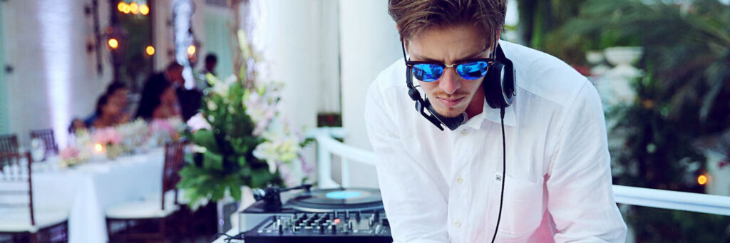 Wedding DJ wearing sunglasses in Turks and Caicos.