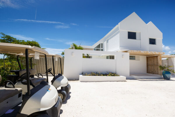 Golf carts outside of a villa