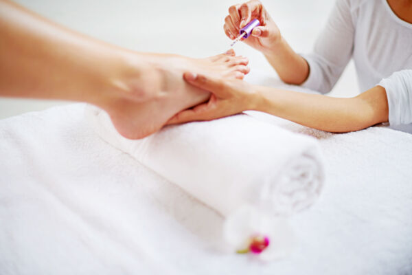 Person receiving a pedicure at a spa