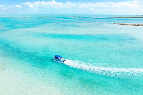Turks and Caicos boat tour in crystal-clear ocean water.