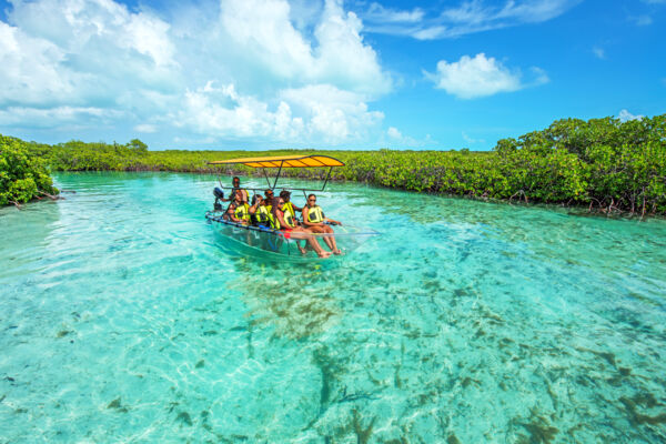 Clear boat in a tidal creek at Mangrove Cay in the Turks and Caicos