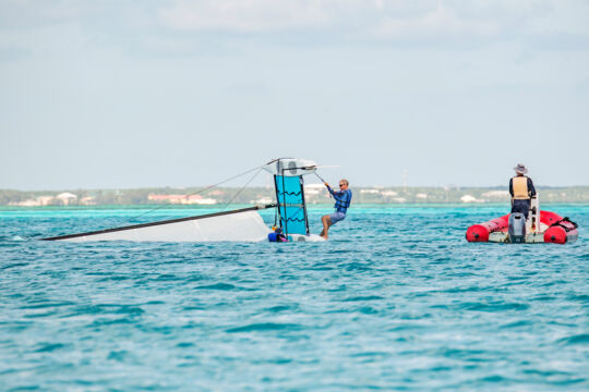 Capsized Hobie Cay sailboat
