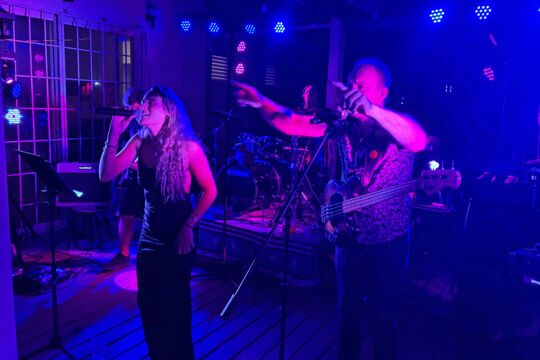 Band performing at a rugby club