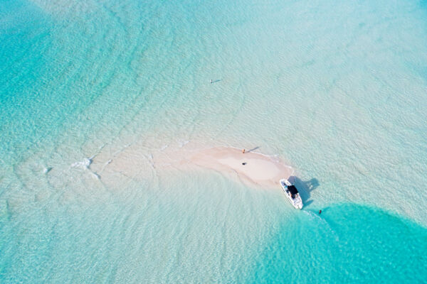 Sandbars, boat, and shallow turquoise ocean water