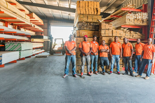 KB Home Center employees in the lumber warehouse