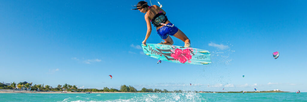 Woman kiteboarder practicing at Long Bay Beach