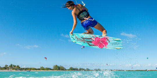 Woman kiteboarder practicing at Long Bay Beach