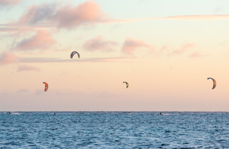 Kiteboarders and the sunset at East Bay on South Caicos