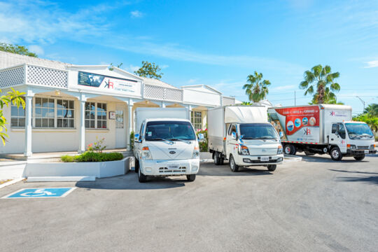 Moving vans at the KR Logistics office in Turks and Caicos