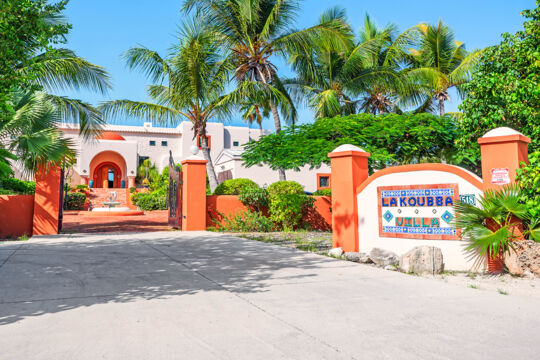Villa gate with sign.