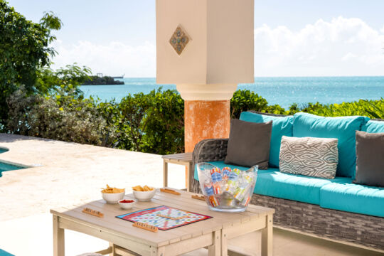 Open-air terrace and table with Scrabble game. 