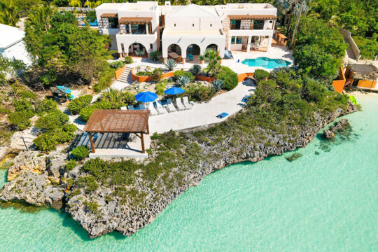 Aerial view of a luxury oceanfront villa in Turks and Caicos.