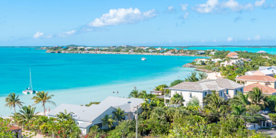 The view of Sapodilla Bay, Chalk Sound and luxury villas from Sapodilla Bay Hill