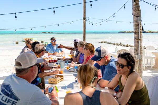 Tour group having lunch on the beach in Turks and Caicos.