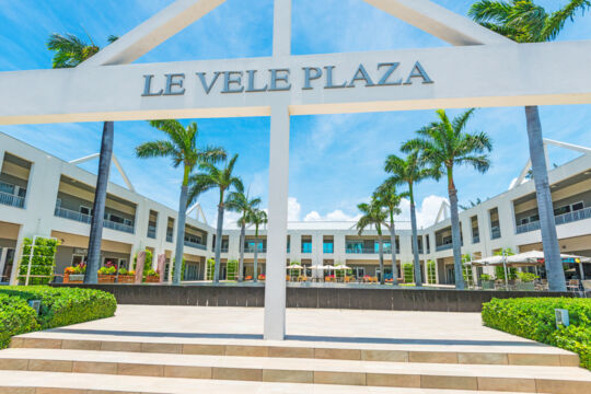 Sign and courtyard at Le Vele Plaza in Turks and Caicos
