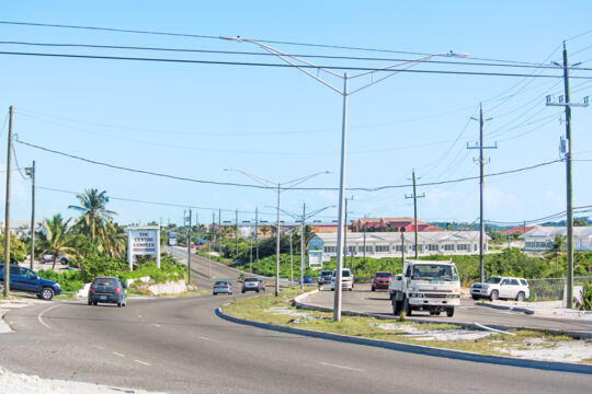 Vehicles driving on the paved Leeward Highway in Turks and Caicos