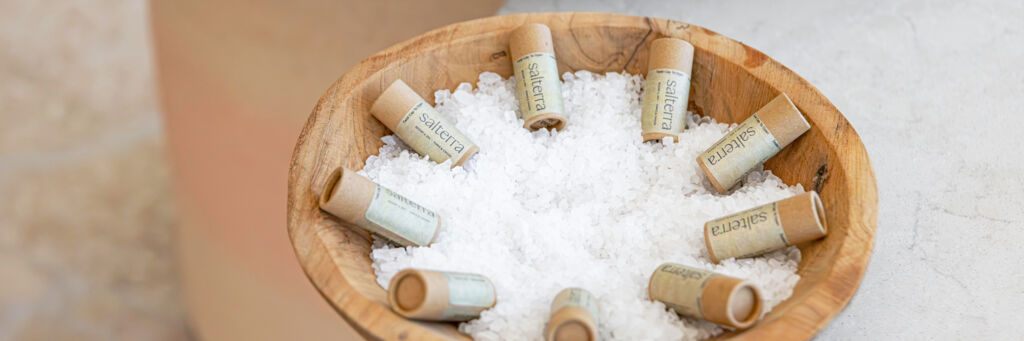 Lip balms arranged in a bowl of sea salt at a Turks and Caicos boutique.