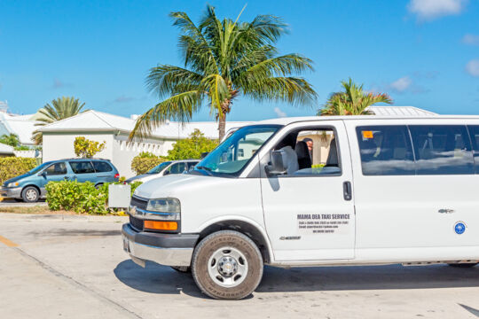 White taxi van parked at the Grand Turk Cruise Center