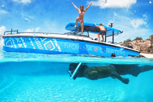 Overunder view of Moana Charters boat in the clear water of the Turks and Caicos