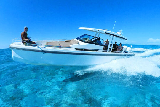 Yacht on clear turquoise ocean water