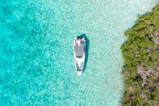 Overhead view of Okeanos Charters Axopar yacht at Mangrove Cay in the Turks and Caicos