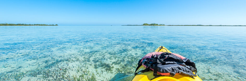 Kayak on the calm and shallow waters of Bottle Creek lagoon near North Caicos