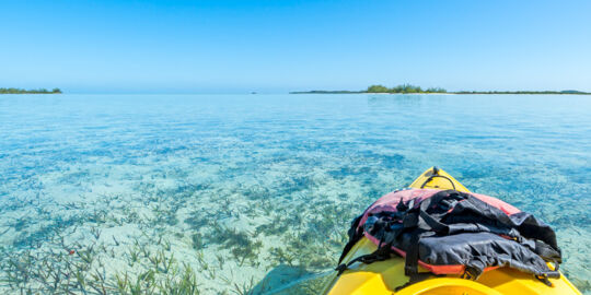 Kayak on the calm and shallow waters of Bottle Creek lagoon near North Caicos