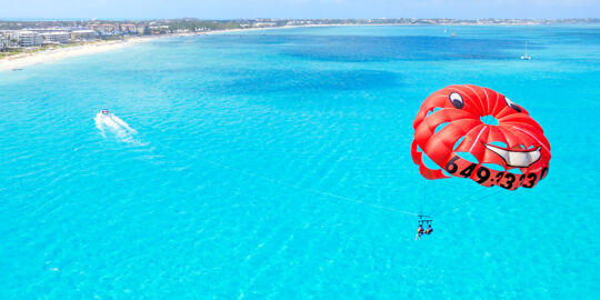 Parasailing off Grace Bay Beach at Providenciales