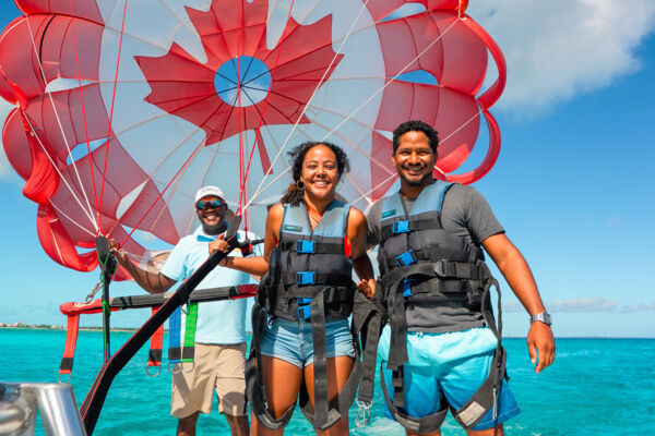 Parasail canopy and guests on a boat at Grace Bay