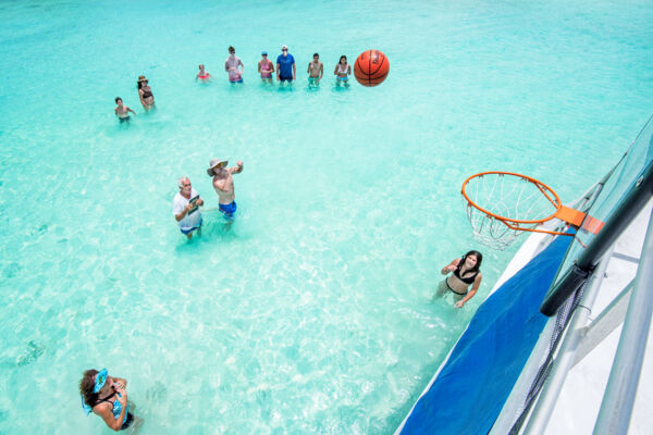 Playing water basketball on a boat charter